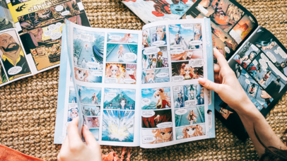 Woman reads manga comic book on the carpet at home